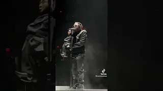 Kendrick Lamar performs with a ventriloquist dummy on stage