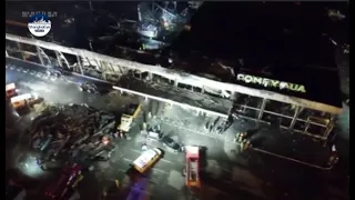 Drone footage of Ukraine shopping mall hit by missile strike showing smouldering remains