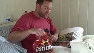 Bill eats doritos