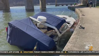 Removing the abandoned boat sinking in the Allegheny River is no easy task