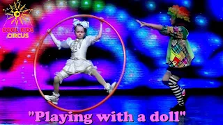 Clownery - "Playing with a doll". Children acrobats on hoops - "Cyr Wheel".
