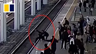 Train officer stops man from jumping onto track