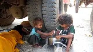 Walking through sewage in the slums of Mumbai, India