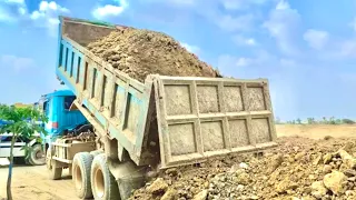 This is the action of the car and Eska who are pouring soil to build a road.[CAT-CAR]