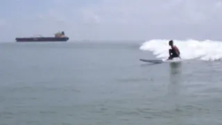 Texas Tanker surfing with Dolphins