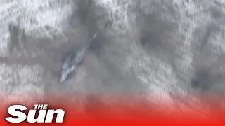 Moment Russian attack helicopter is blown out the sky by Ukrainian artillery