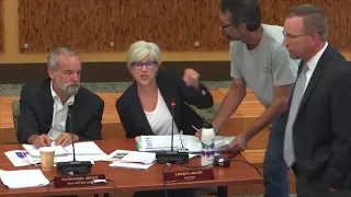 Olympia City Council meeting interrupted as pair tries to deliver lawsuit to mayor