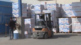 Dozens of trucks bring aid into Gaza through the Rafah crossing