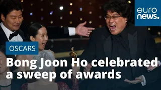 Bong Joon Ho celebrated a sweep of awards at the Oscars, as his movie Parasite won six trophies