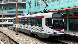輕鐵第一期列車1005駛經澤豐二台回廠+1016停泊在兆康四台