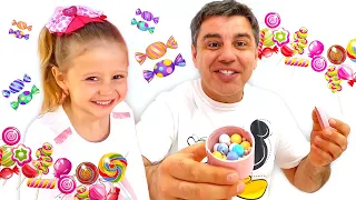 Nastya fait de bonnes actions et papa la récompense avec des bonbons