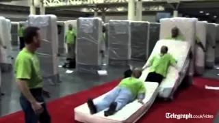 Human mattress dominoes attempt breaks world record