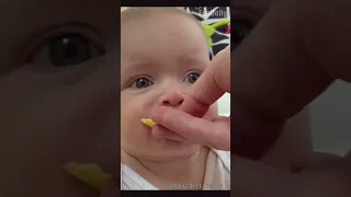 Funny Expression Of Baby Trying Lemon