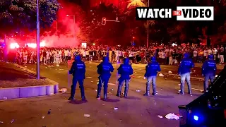 Football fans clash with Madrid police after Champions League game