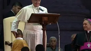 Boy jumps on stage with pope, refuses to leave