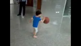 Two Year Old Dribbling a Basketball