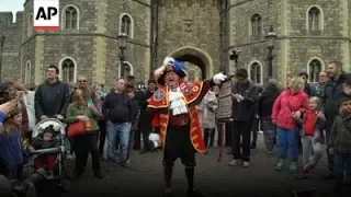 Man dressed as a town crier announcing the birth of the royal baby.