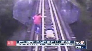 Women escape death on railroad bridge