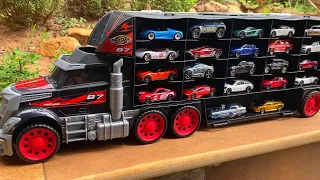 29 type Tomica Cars sliding down from big black truck Transporter | Mini Car | Tomica Disney Cars