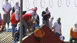 Rioting prisoners in Brazil abuse hostages in rooftop protest