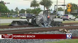 Driver rushed to hospital after car struck by train in Pompano Beach