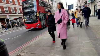 Street fashion in London. Nice street style. Walks around the city.