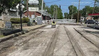 Louisville Water Company unearths street car lines while repairing water main