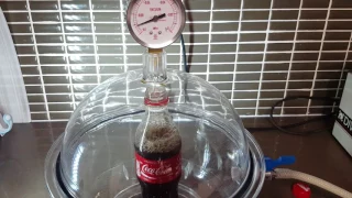 Coca-Cola in a vacuum chamber