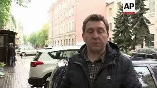 People lay flowers outside Ukrainian embassy in honour of those who died in the Odessa fire