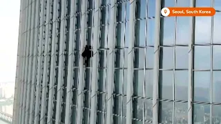 Man forced off Seoul skyscraper  after climbing without ropes