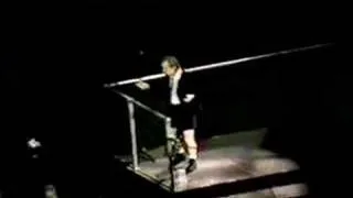 AC/DC - "Fan" throws a beer at Angus Young