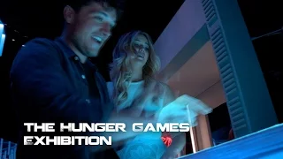 Behind The Scenes: Jennifer Lawrence And Josh Hutcherson At The Hunger Games Exhibition