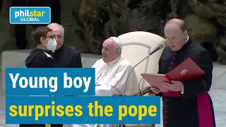 Pope Francis surprised as boy walks on stage