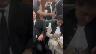 Imran Khan earlier today with Barrister Salman Safdar during his court appearance