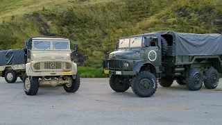 test of two military trucks going up a ravine of 3 meters