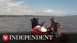 Police officers borrow boat to chase after suspect on stolen jet ski