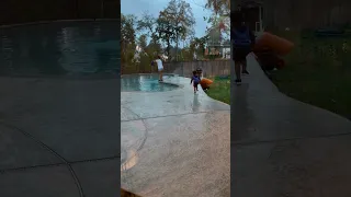 Dad gives son giant lollipop to push mom in the pool #shorts