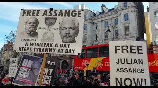 Supporters of Wikileaks founder Julian Assange protest outside the Royal Courts of Justice in London