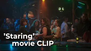 Sitting In Bars With Cake (2023) Movie Clip 'Staring'