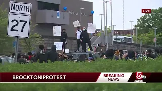 Large group gathers near Brockton police HQ