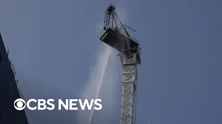 Crane catches fire, partially collapses in New York City