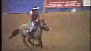 Cute little Girl Running Barrels on a little horse