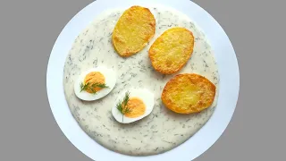 Sweet and sour dill sauce with eggs and baked potatoes.