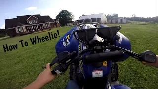 How to Wheelie a Automatic Four Wheeler!