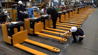 Process of Making an Electric Fork Pallet Truck. Logistics Equipment Factory in Korea.