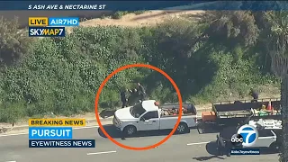 Possible murder suspect attempts to carjack truck on 405 freeway before being tackled by police