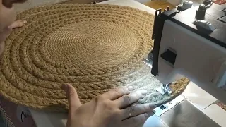 Sewing of a carpet from a jute braid and a rope.