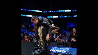 Charlotte flair power bomb Ronda rousey on announcer talble