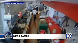 A violent attack at a fast food restaurant is caught on camera