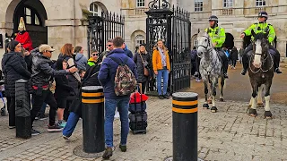 MOVE IT IDIOT! POLICE stop to REPRIMAND tourist who leaves luggage unattended at Horse Guards!